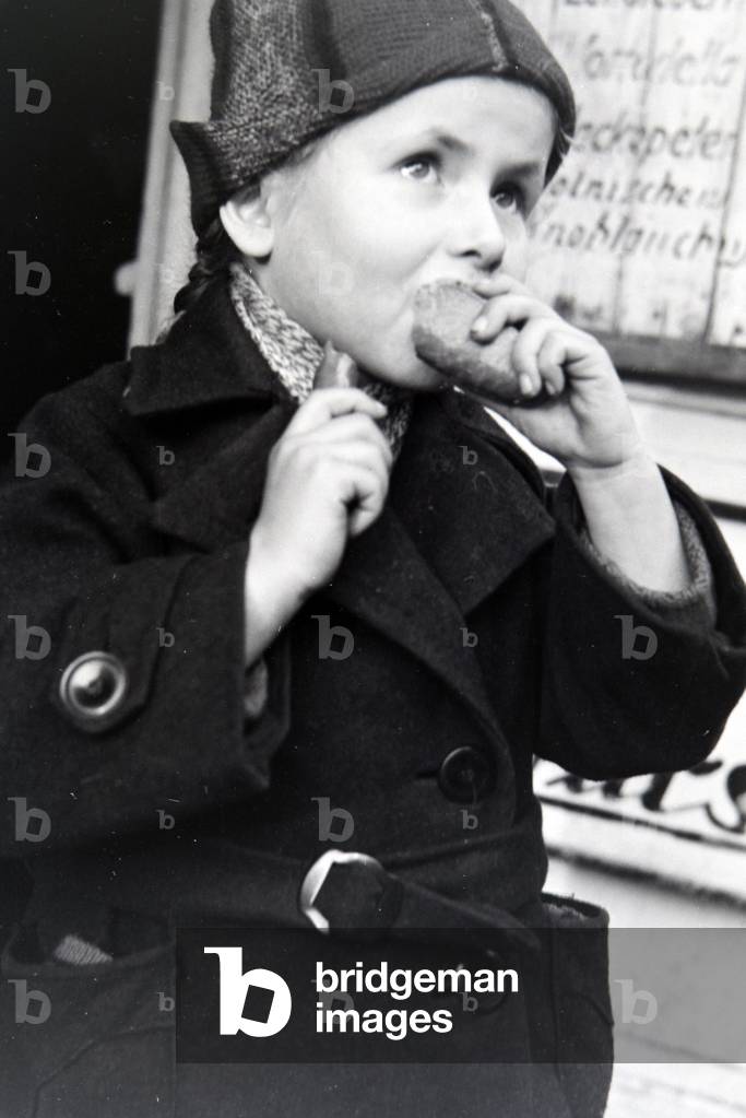 Child at a snack bar in Breslau, Lower Silesia, Germany 1930s (b/w photo)