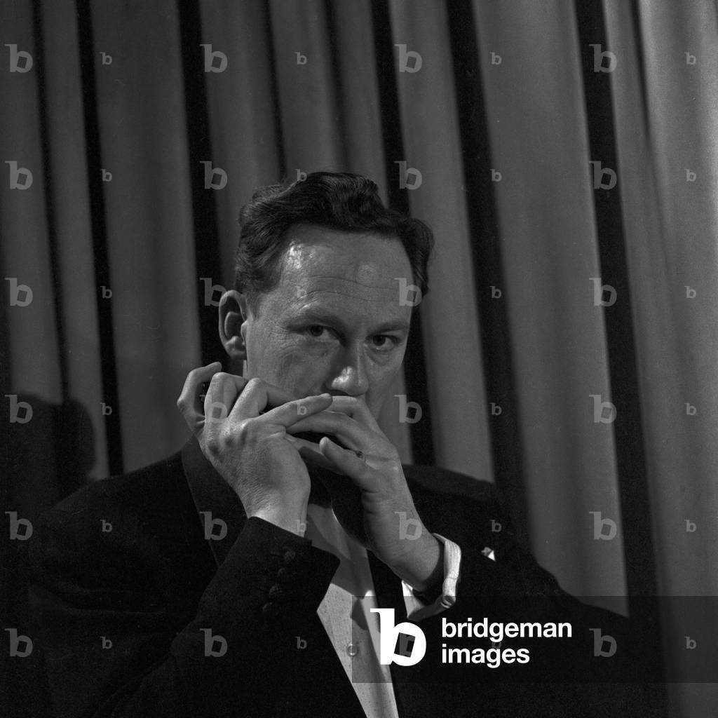 Harmonica player performing at Hamburg, Germany 1950s