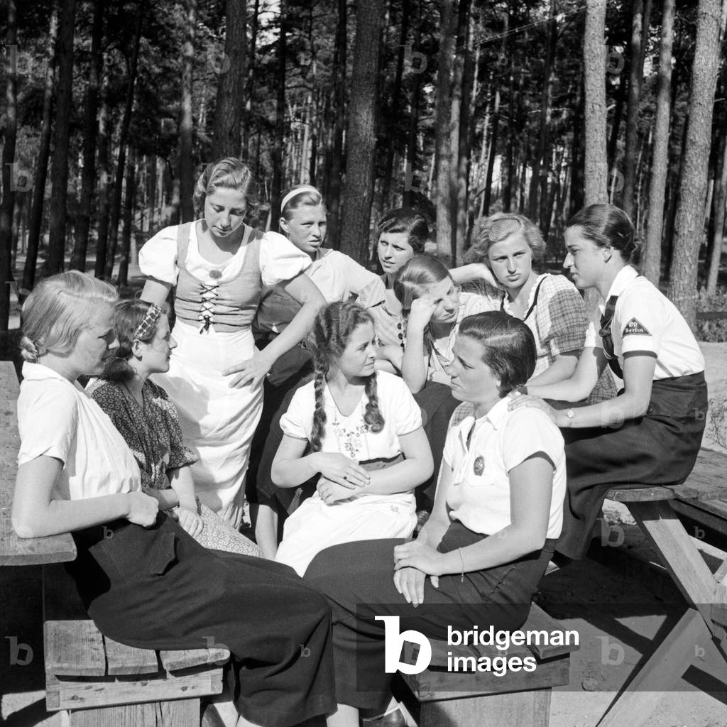 A group of BDM girls sitting in the sun at leisure camp of Deutsche Arbeitsfront at Altenhof, Brandenburg, 1930s (b/w photo)