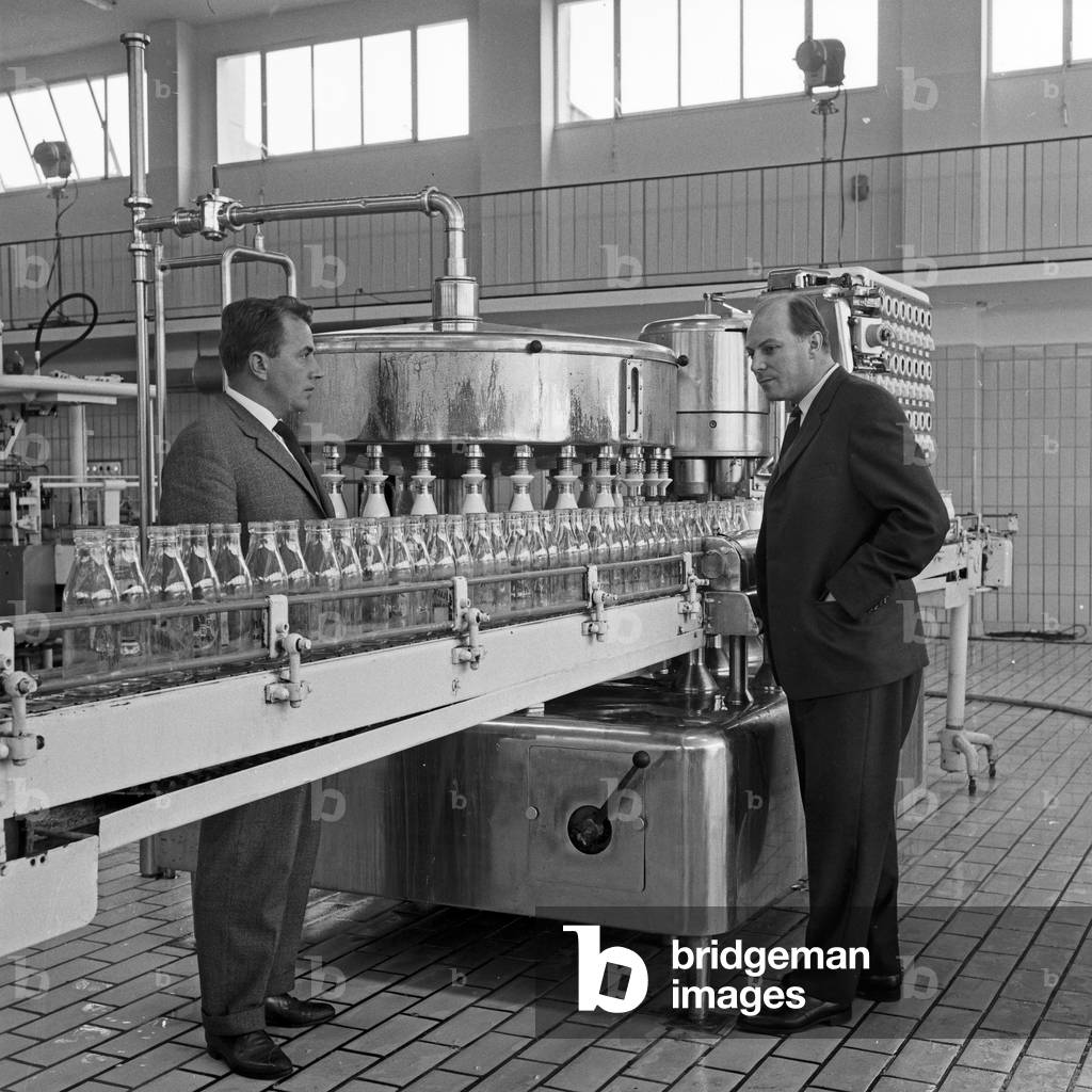 At the production line of Alster dairy factory at Hamburg, Germany 1960s