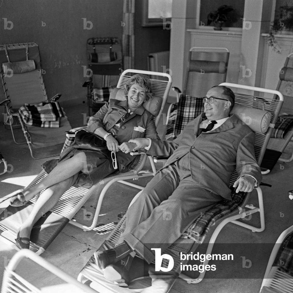 A couple on sunlongers on a terrace, Germany 1960s