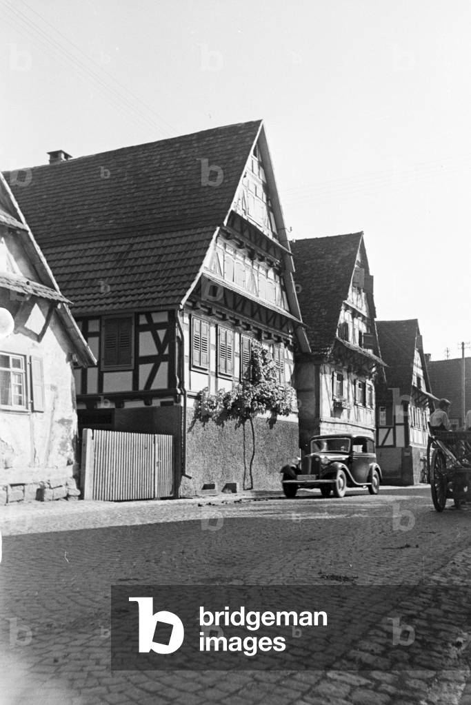 A street with half timbered buildings in Bruchsal, Germany 1930s (b/w photo)