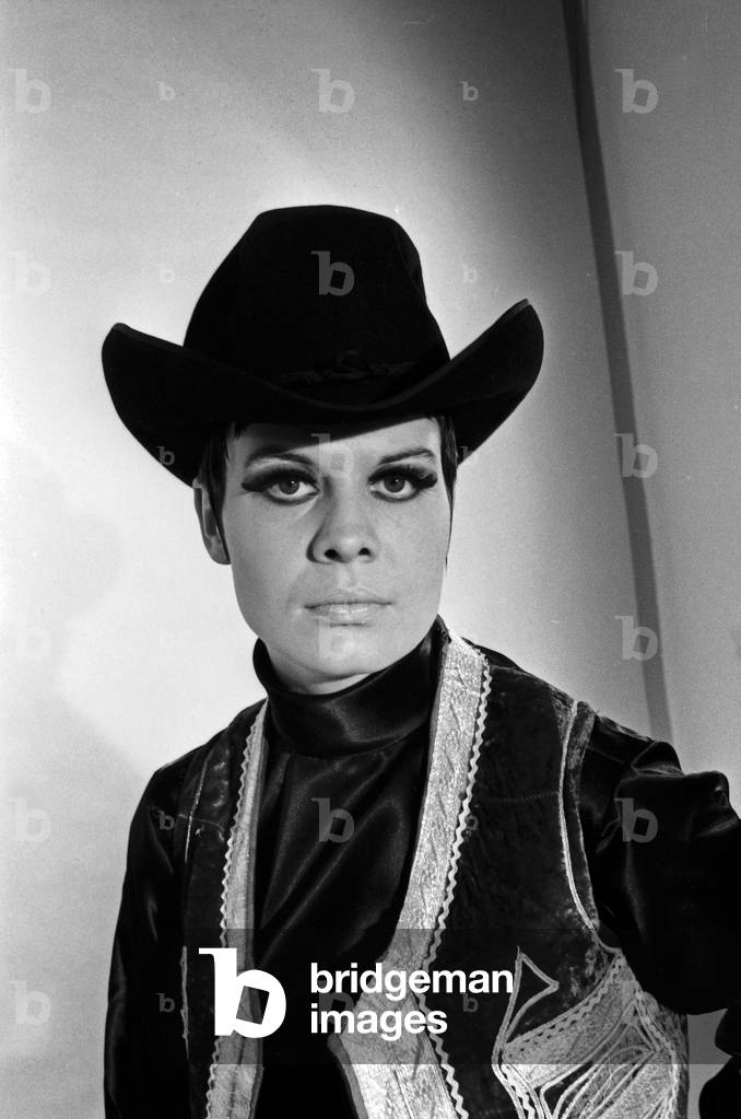 Model Petra posing as a cowboy for German TV magazine 