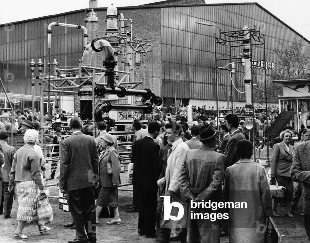 Visitors and customers walking over the Hanover trade fair in 1964