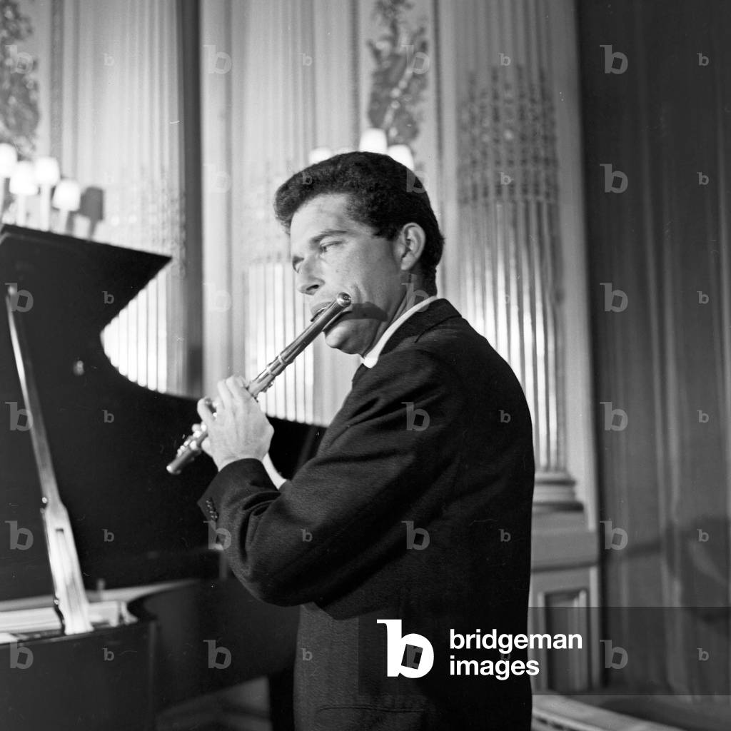 A flutist performing with his transverse flute at Hamburg, Germany 1960s