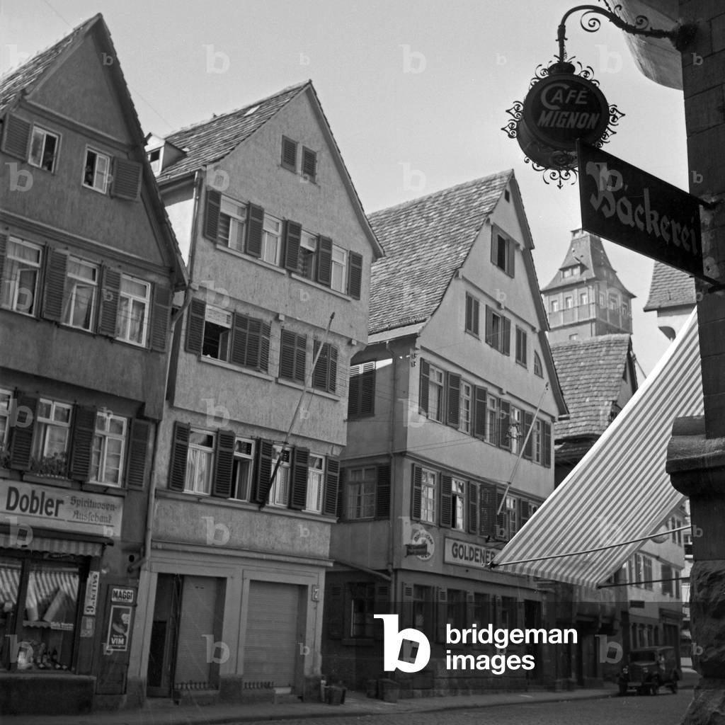 View to Dobler's pub and Cafe Mignon bakery at Stuttgart, Germany 1930s (b/w photo)