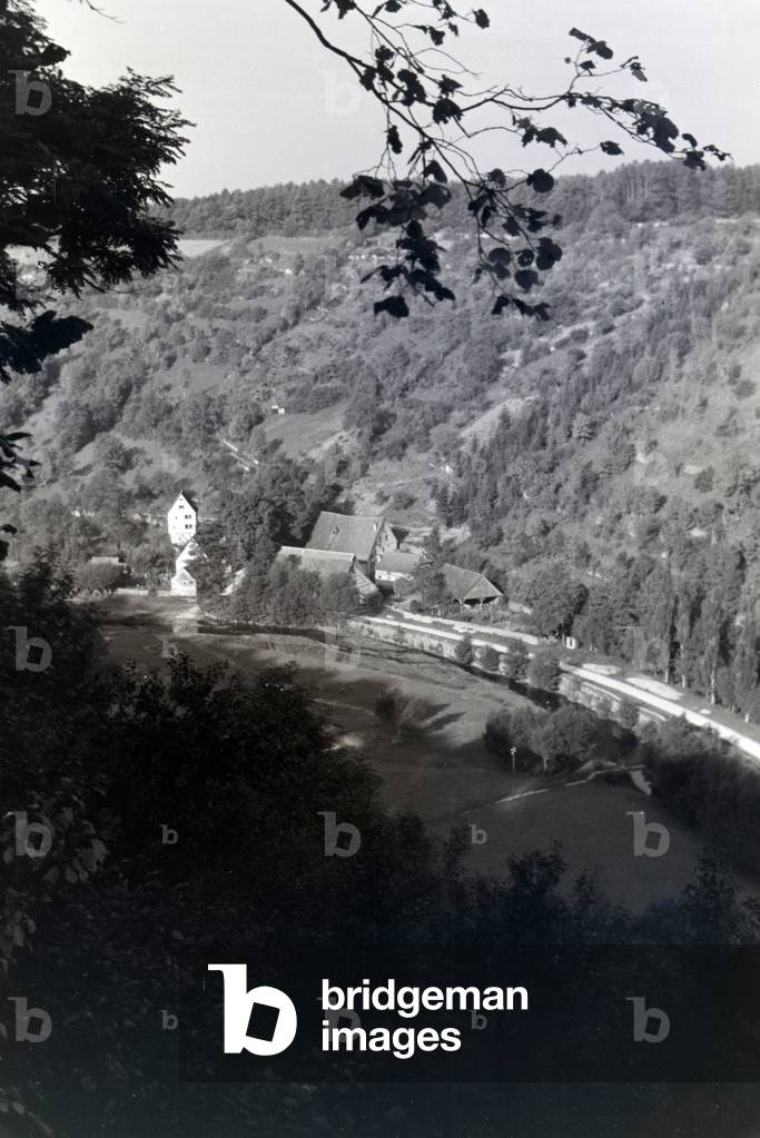 View of half-timbered houses of the town Rothenburg ob der Tauber embedded in a a beautiful natural landscape, Germany 1930s (b/w photo)