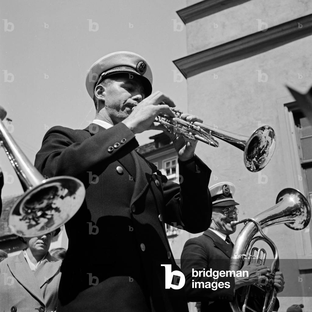 Trumpet player at a pageant, Germany 1930s (b/w photo)