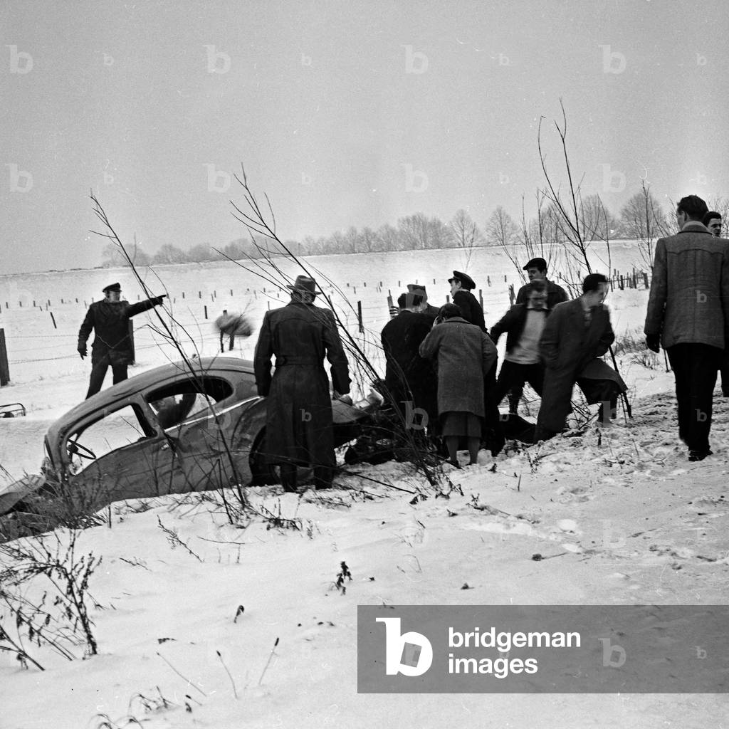 A Volkswagen beetle had an accident and was found in the roadside ditch, Germany 1960s