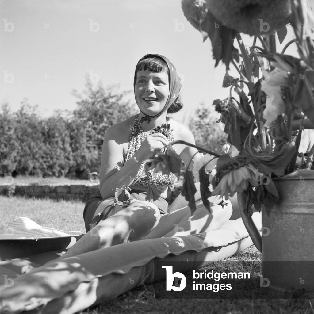 A young woman on an airbed, Germany 1930s (b/w photo)