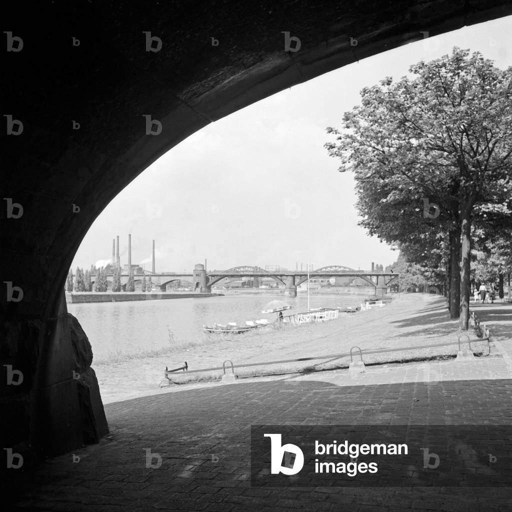 View to the shore of river Ruhr and the Friedrich Wilhelms Huette metallurgical plant at Muelheim, Germany 1930s (b/w photo)