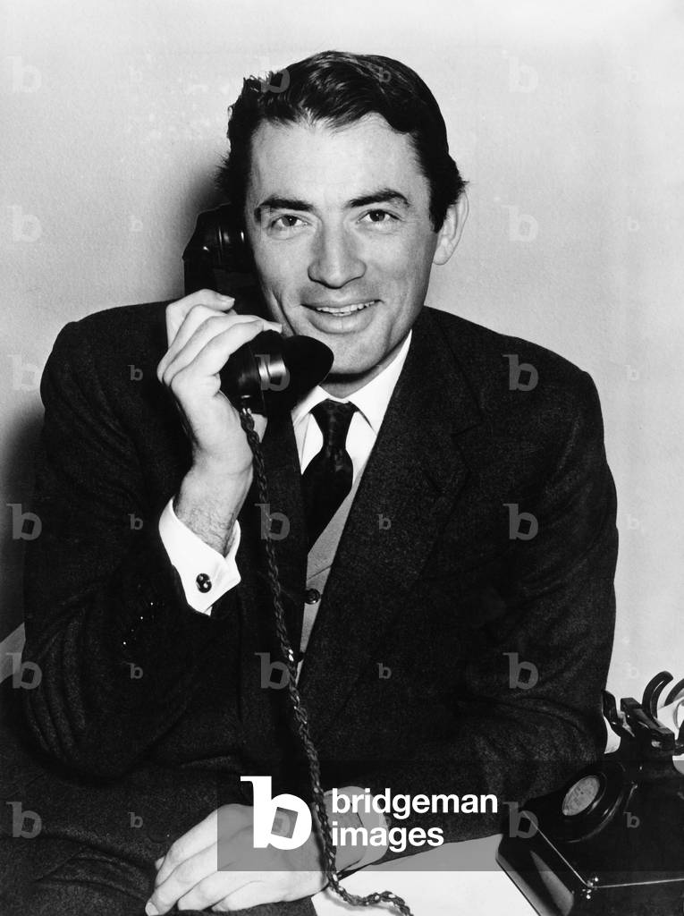 American actor Gregory Peck on the phone, 1950s