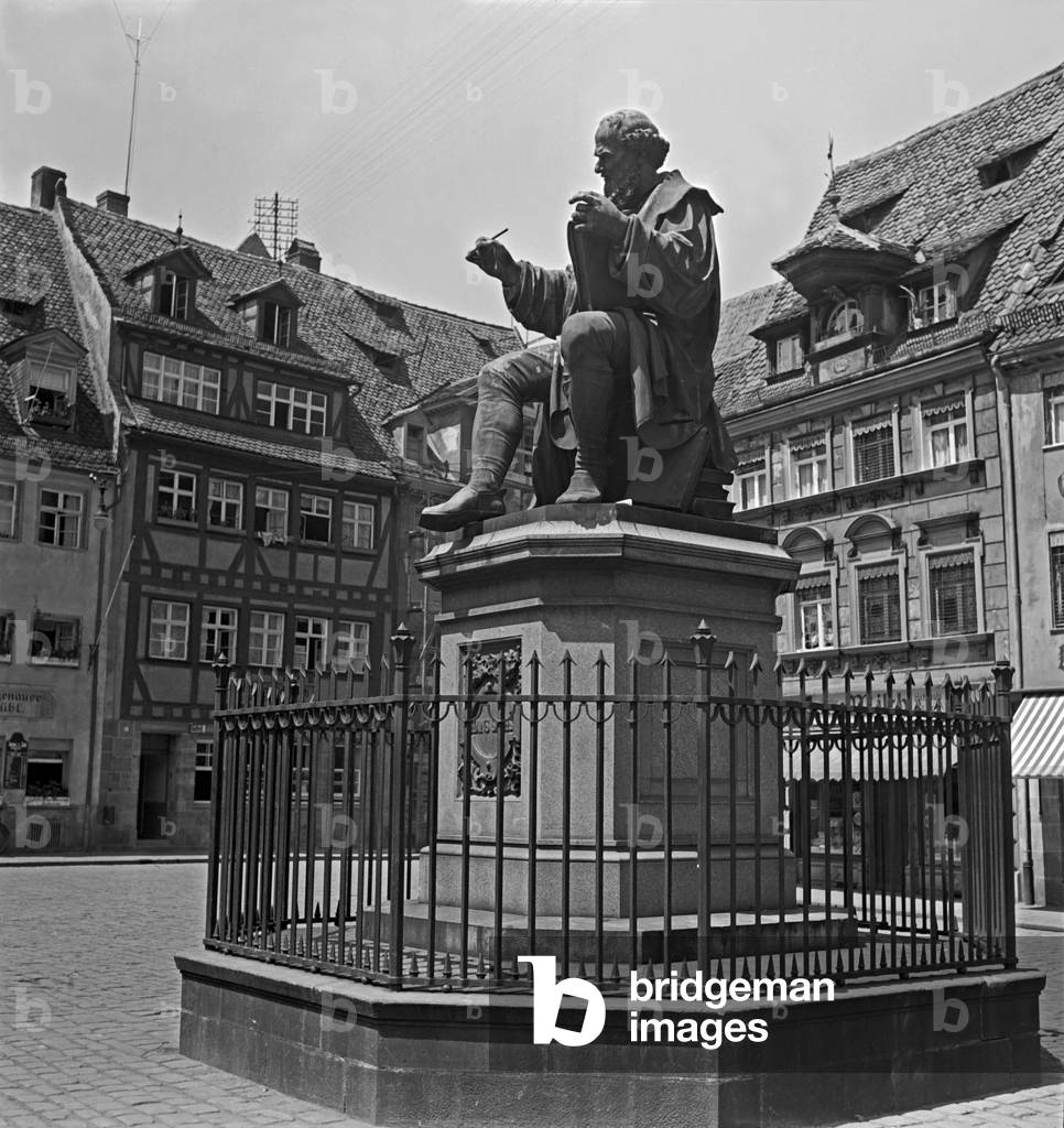 The Hans Sachs monument on Spitalplatz square in the old city of Nuremberg, Germany 1930s (b/w photo)