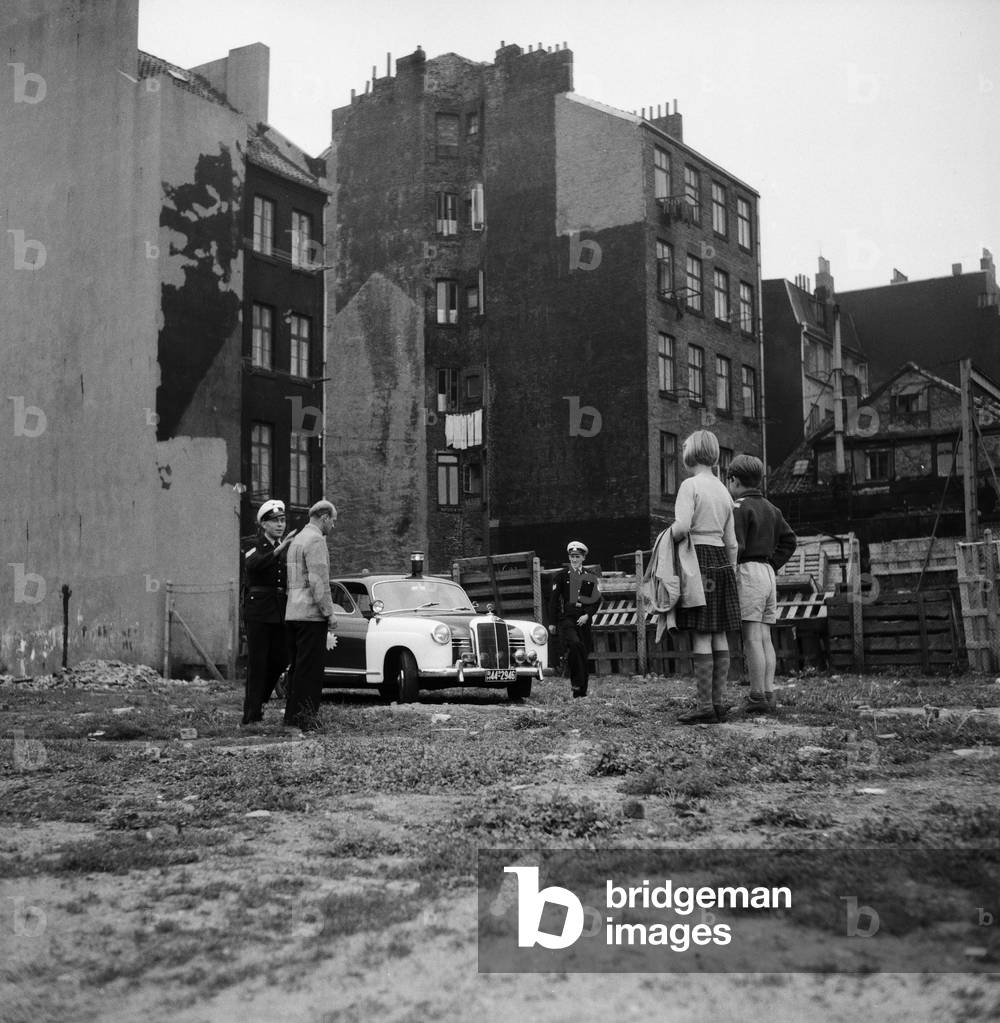 Policemen arresting a man
