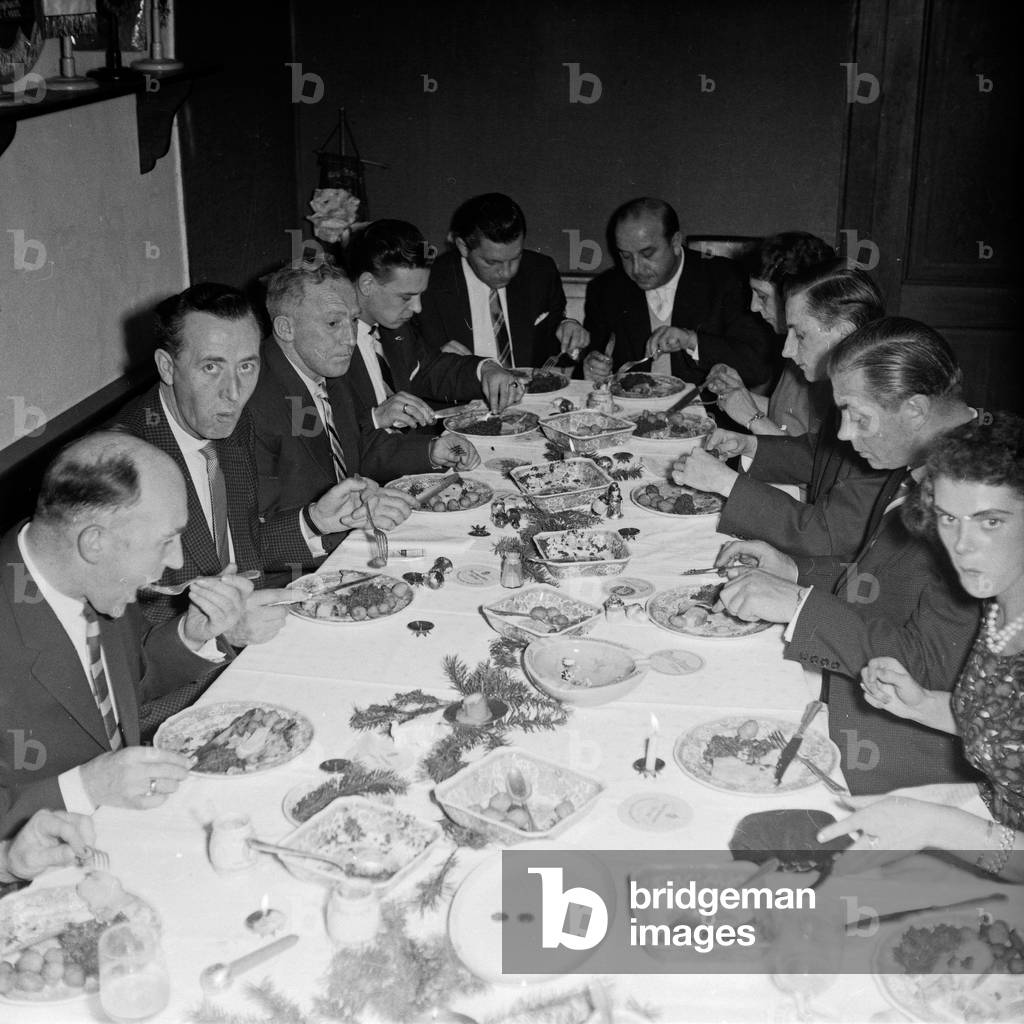 Before skittling a ninepins club has supper, Germany 1960s
