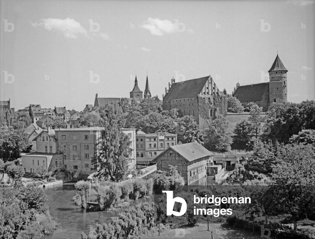 View to the old city, the castle, the Catholic church and the river Alle at Allenstein, East Prussia, 1930s (b/w photo)