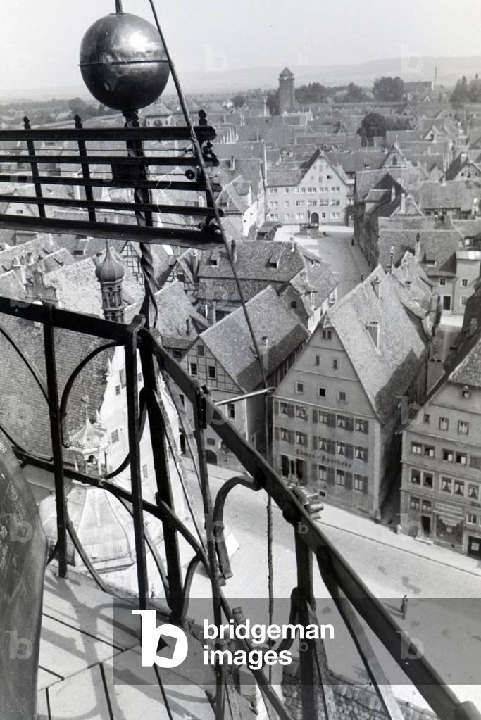 The highest tower of the townhall presents an excellent view over the whole city center and the surrounding natural landscapes of Rothenburg ob der Tauber, Germany 1930s (b/w photo)