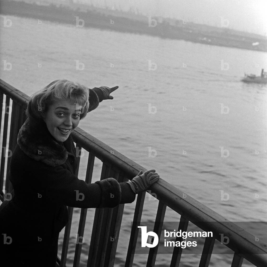 Austrian jazz and Schlager singer Ernie Bieler doing a promotional photo shooting at Hamburg harbor, Germany 1950s