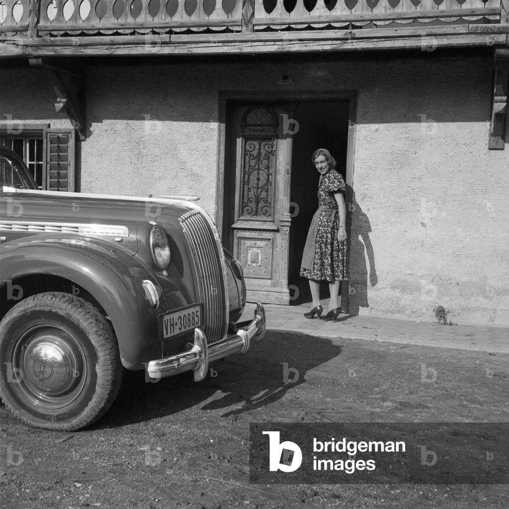 An Opel model Admiral in front of an elementary school at Austria, 1930s (b/w photo)