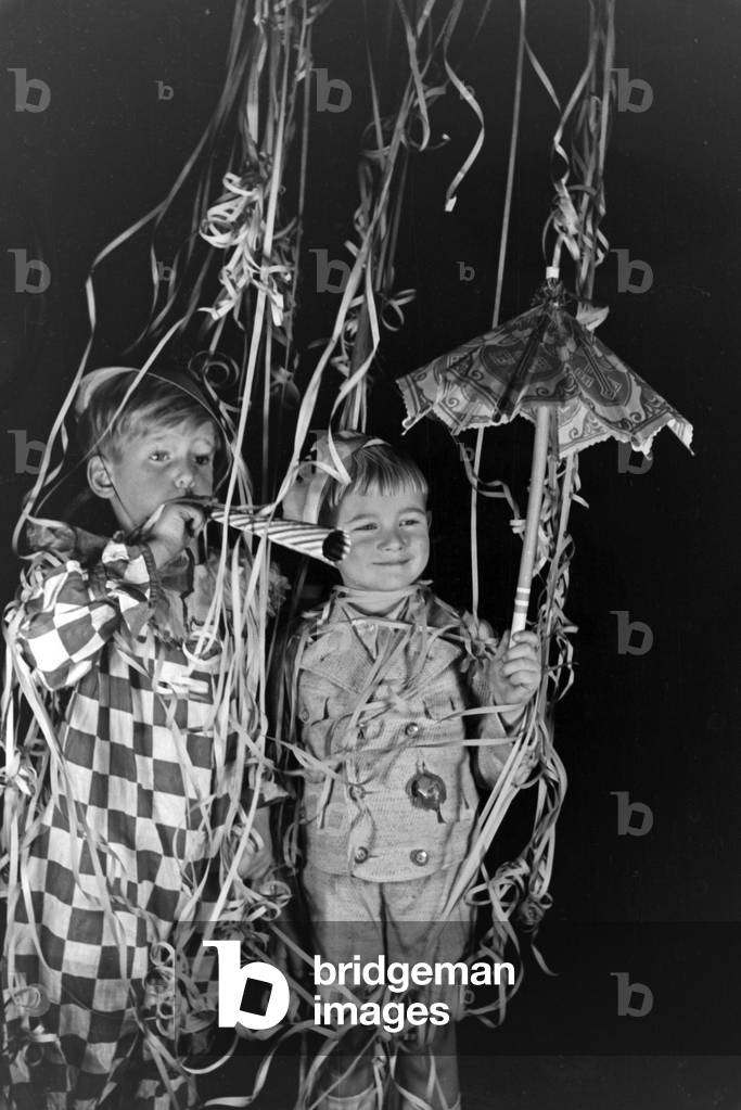 Two little boys dressed for a carnival, Germany 1930s (b/w photo)