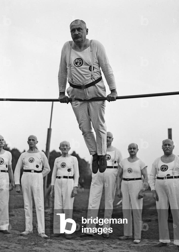 Members of a senior department of a gymnastic club exercising, Germany 1930s (b/w photo)