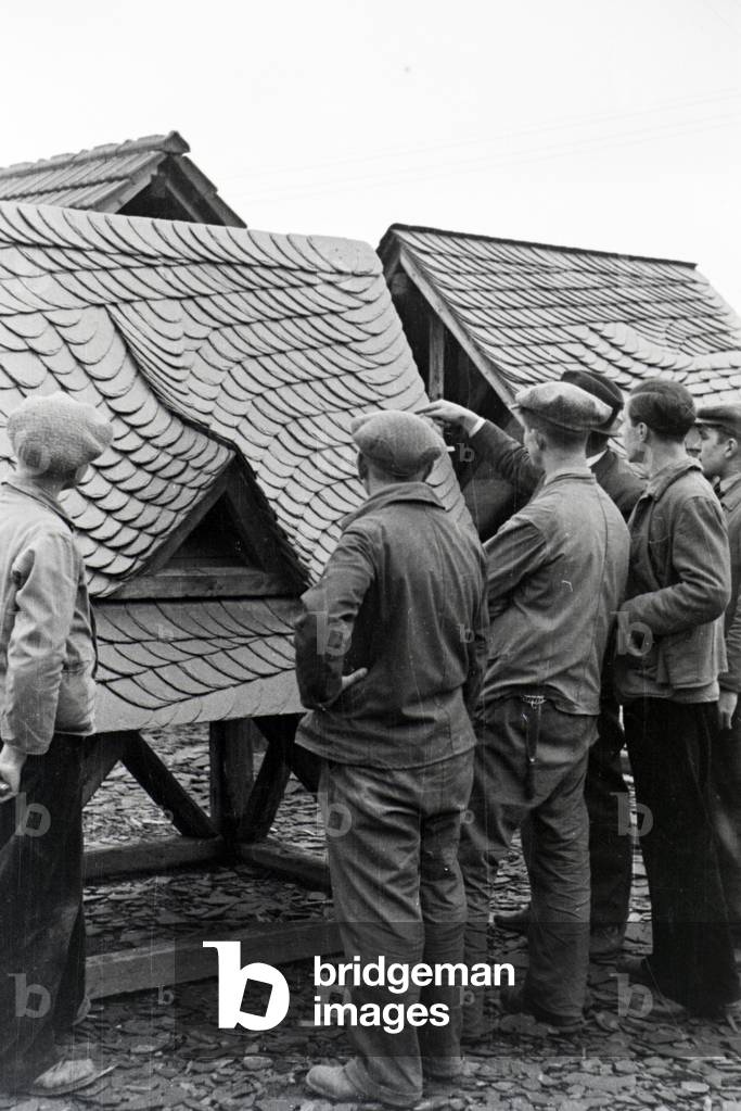 Trainees of a roofer school at a tutorial, Germany 1937 (b/w photo)