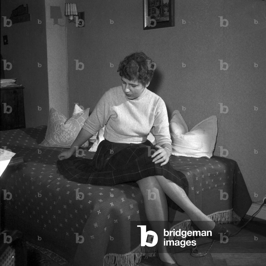 A young girl on a sleeping sofa, Germany 1955