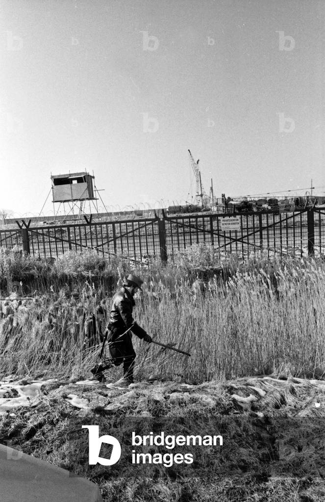Police scanning the area around the fence of Brokdorf nuclear plant, Germany 1980s