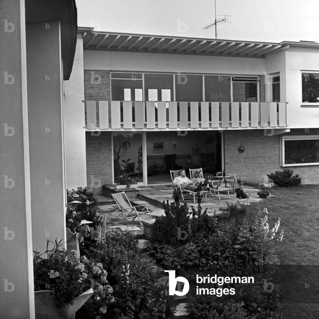 Peter Frankenfeld with his wife Lonny Kellner at the terrace of his home at Wedel near Hamburg, Germany 1950s