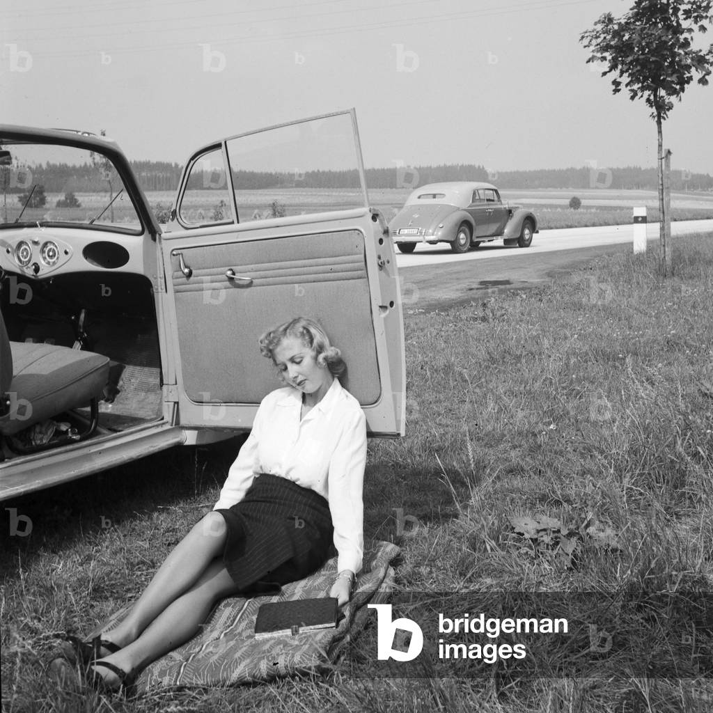 Resting by the street, Germany 1930s (b/w photo)