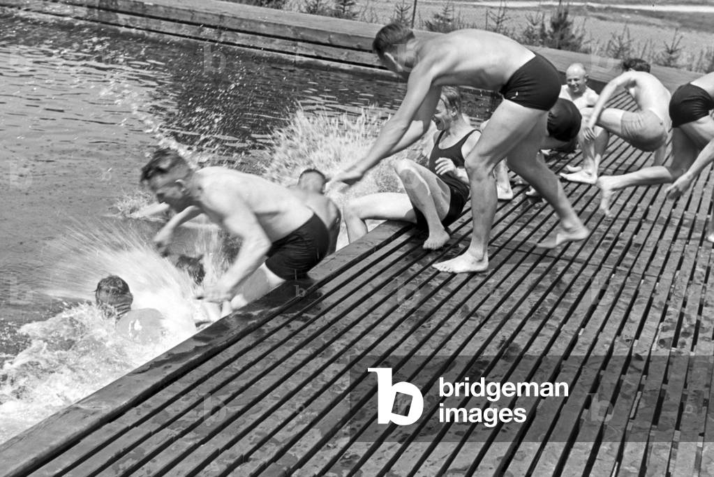 Warming up for a swimming competition at the sports club at Belzig in Brandenburg, Germany 1930s (b/w photo)