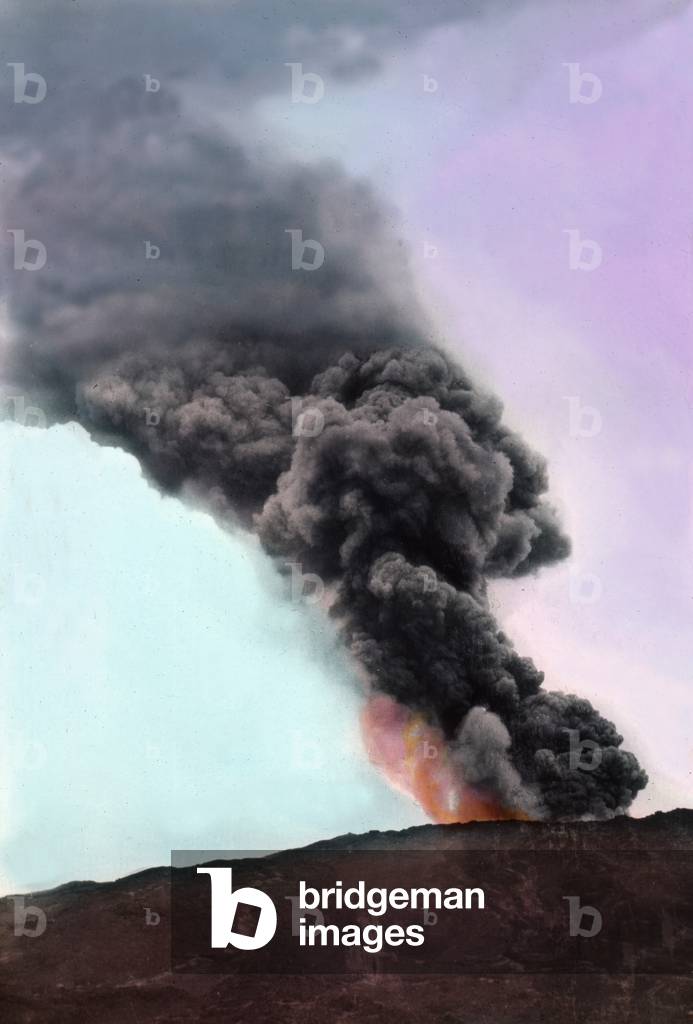 An enormous column of smoke coming from a volcano