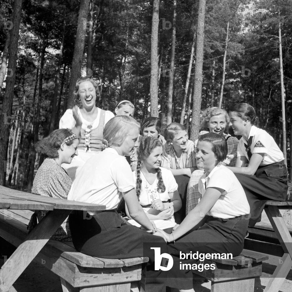 A group of BDM girls sitting in the sun at leisure camp of Deutsche Arbeitsfront at Altenhof, Brandenburg, 1930s (b/w photo)