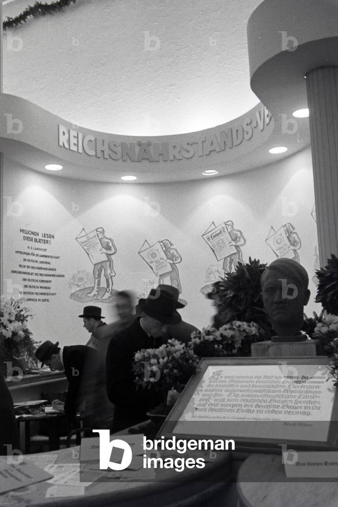 A stand by the organisation Reichsnährstand with a bust of Adolf Hitler on the occasion of the Wiener Modewoche in the house of fashion 