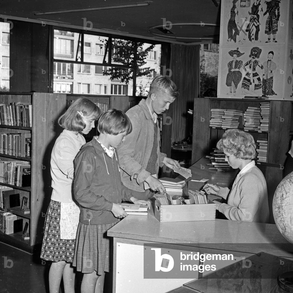 People at a public library in Hamburg, Germany 1960s
