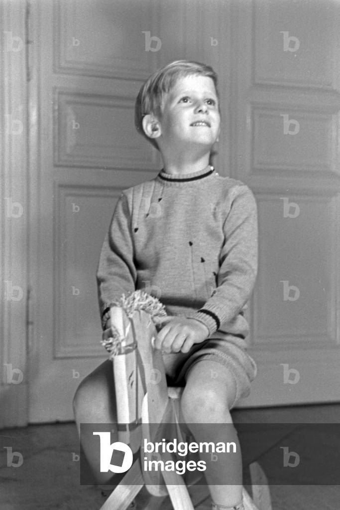 A little boy on his rocking horse, Germany 1930s (b/w photo)