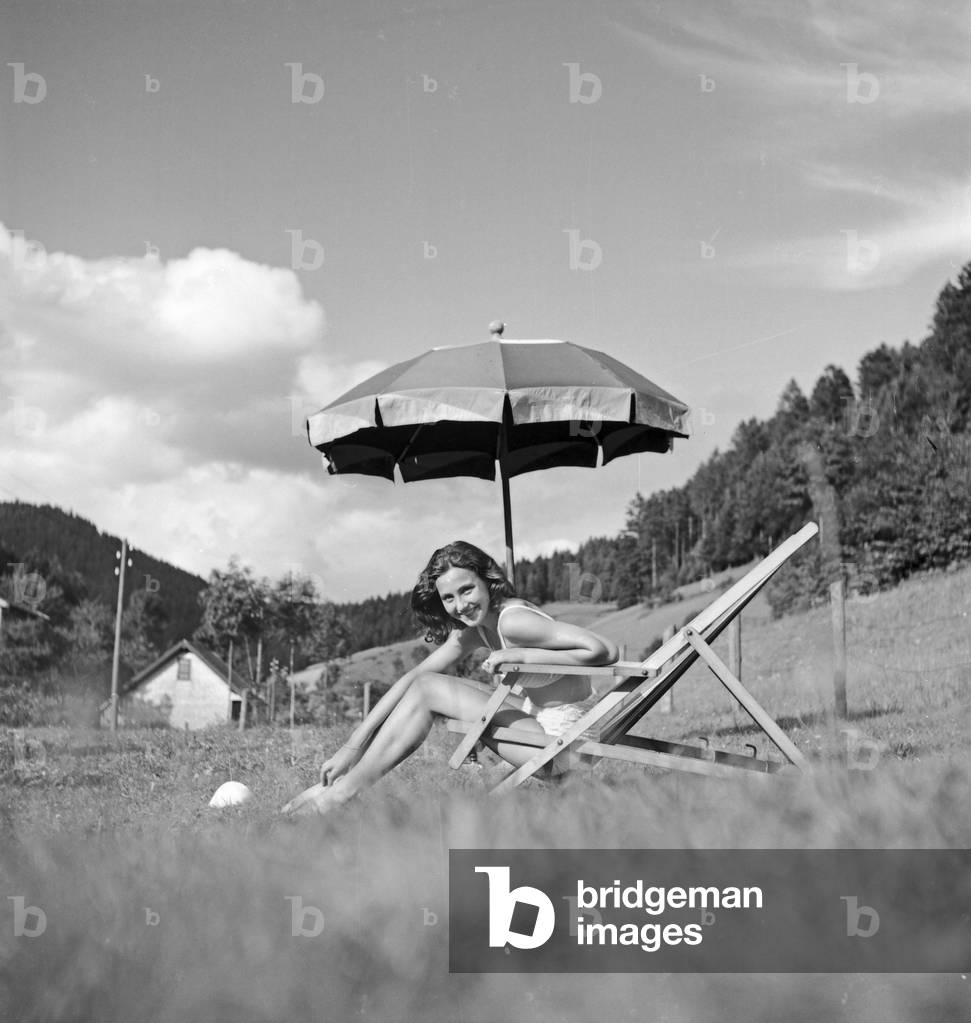 German actress Evelyn von Schoening at the spa resort Villa Sommerberg at Bad Rippoldsau in the Black Forest, Germany 1930s (b/w photo)