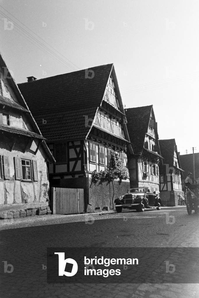 A street with half timbered buildings in Bruchsal, Germany 1930s (b/w photo)