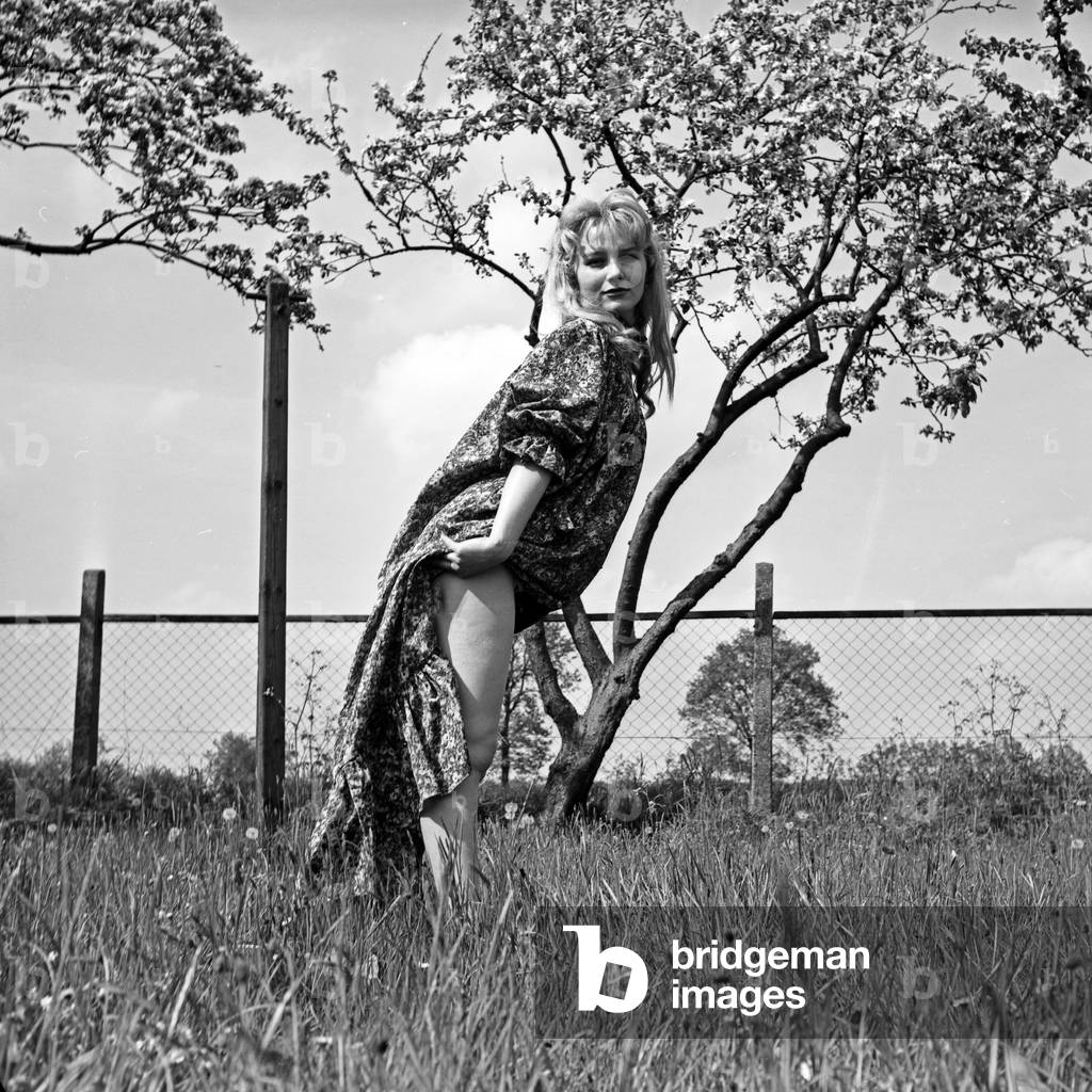 German actress Karin Stoltenfeldt posing in the garden, Germany 1950s