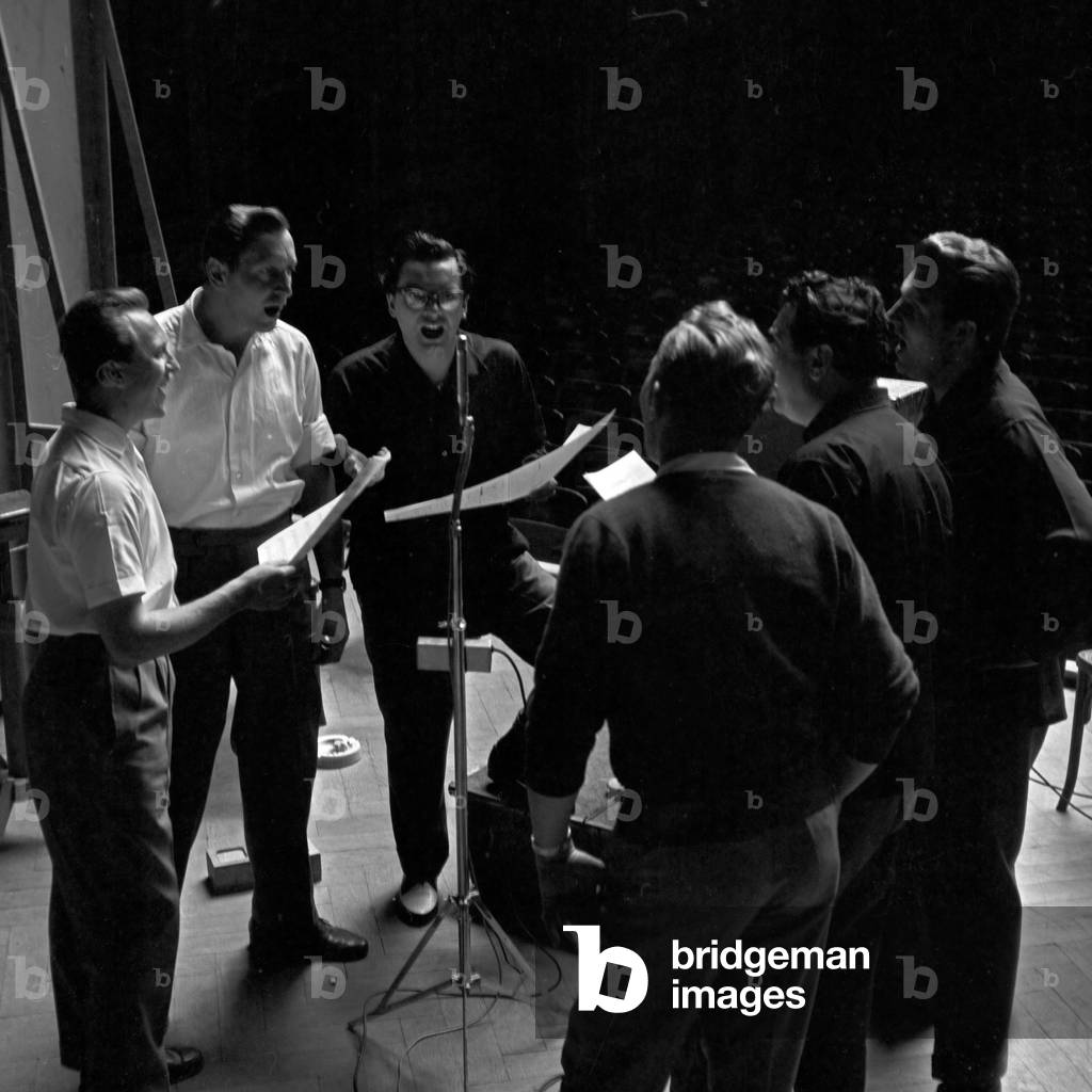 Singer Franco Duval (3rd from right) doing rehearsals in their hotel room at Berlin, Germany 1950s