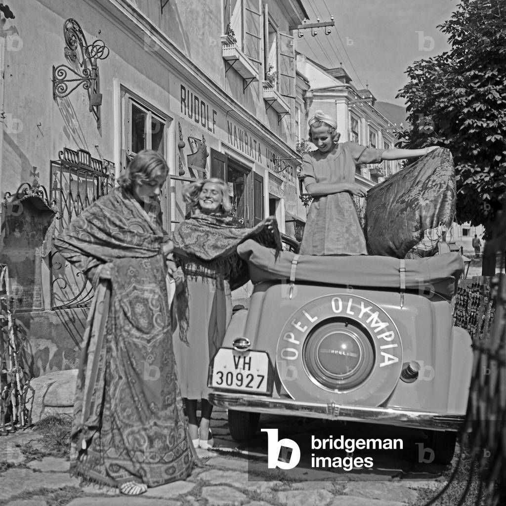 Three young woman bought nice drapery on their cruise through Austria, 1930s (b/w photo)