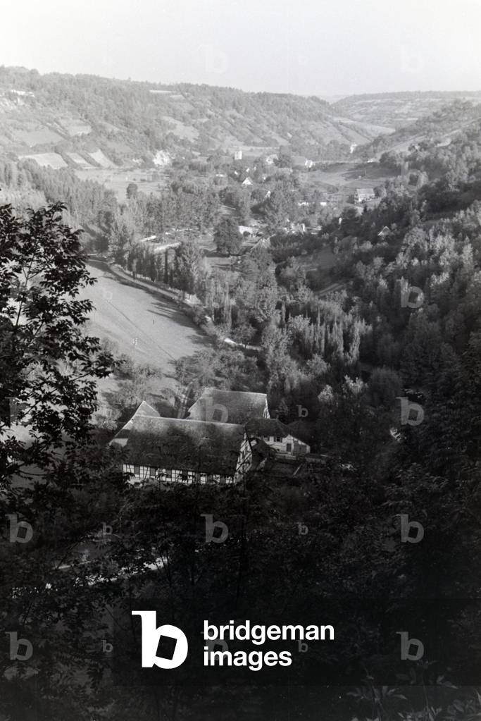 View of half-timbered houses of the town Rothenburg ob der Tauber embedded in a a beautiful natural landscape, Germany 1930s (b/w photo)