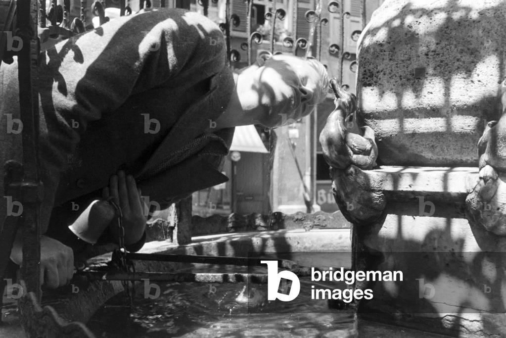 A drinking water fountain in Stuttgart, Germany 1930s (b/w photo)