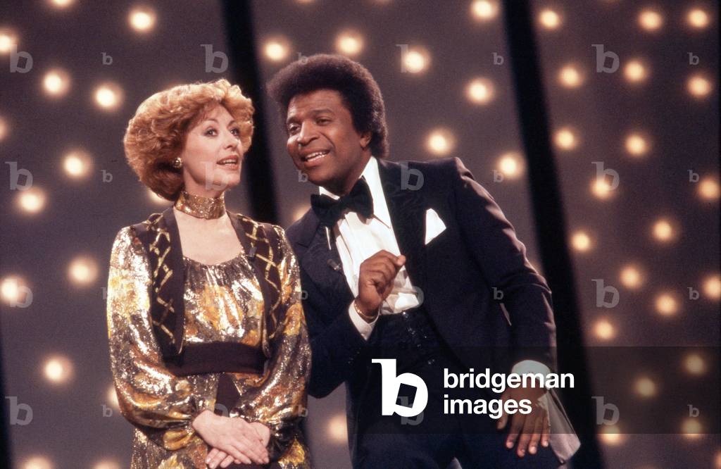 Italian singer, dancer and actress Caterina Valente with singer Roberto Blanco, Germany 1970s