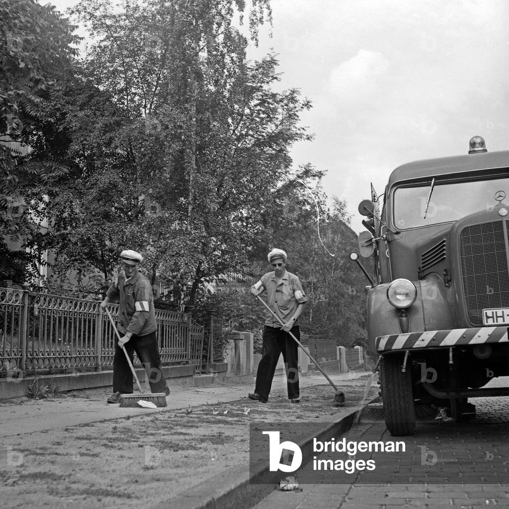 Men of the public street cleaning on the streets of Hamburg, Germany 1960s