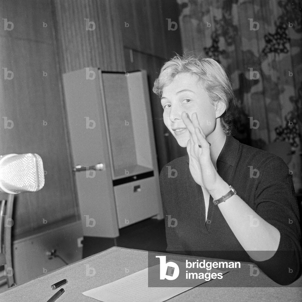 Female speaker of NDR station at a microphone check, GErmany 1950s