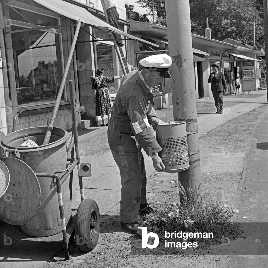 Men of the public street cleaning on the streets of Hamburg, Germany 1960s