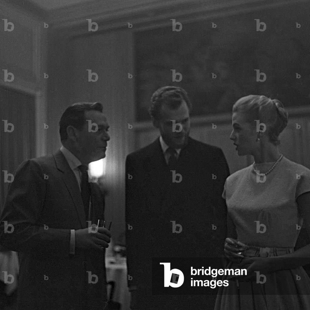 American actor and chansonnier Eddie Constantine meets Danish singer duo Nina and Frederik at Hamburg, Germany 1950s