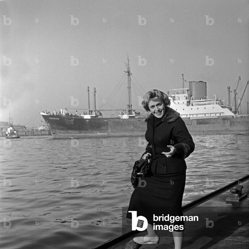 Austrian jazz and Schlager singer Ernie Bieler doing a promotional photo shooting at Hamburg harbor, Germany 1950s