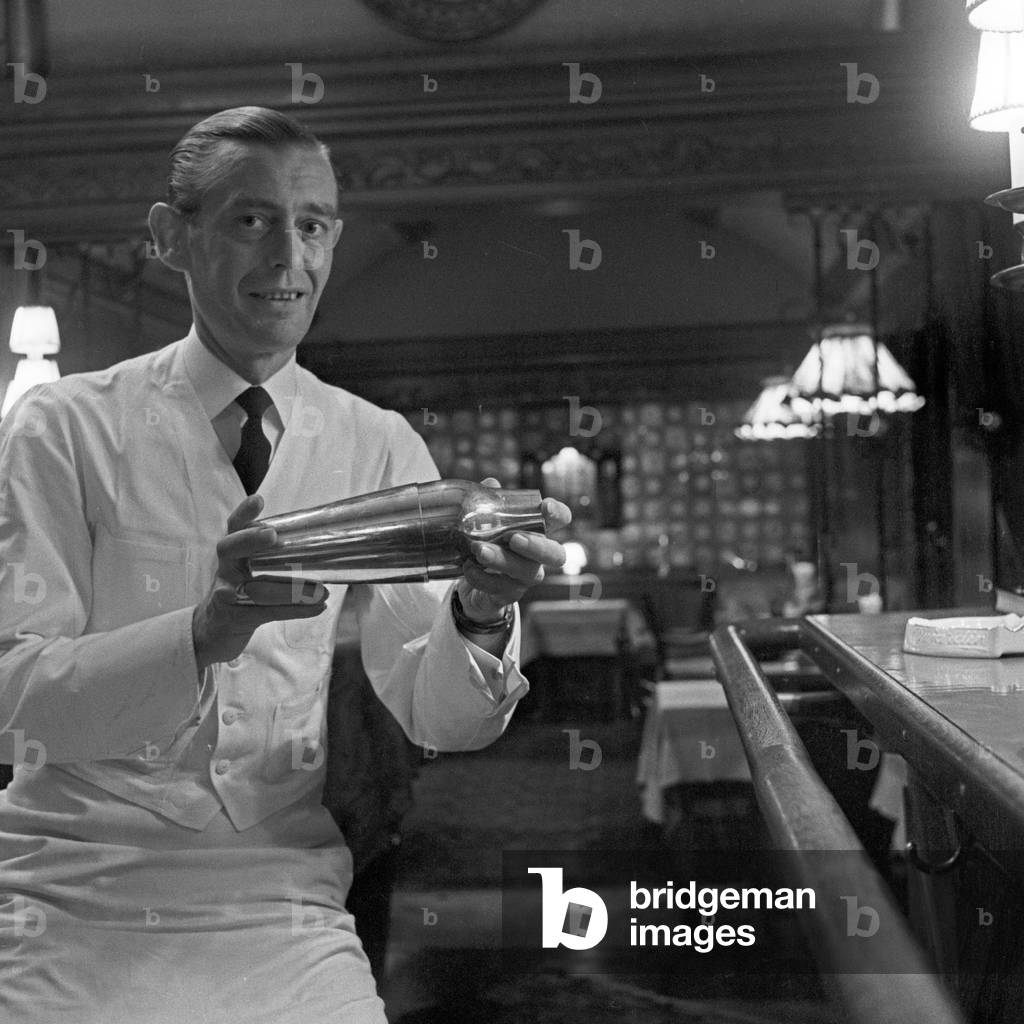 Bartender and mixer at the bar of cabaret and vaudeville theatre 